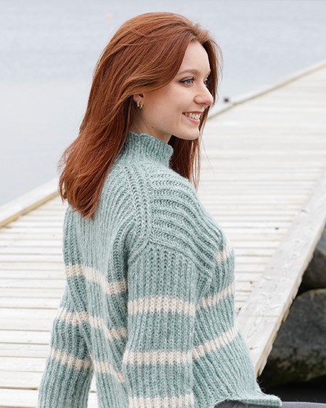 Sweater knitted from DROPS Air yarn. The item is knitted from top to bottom with English rib, has a European/diagonal shoulder and slits on the sides. 