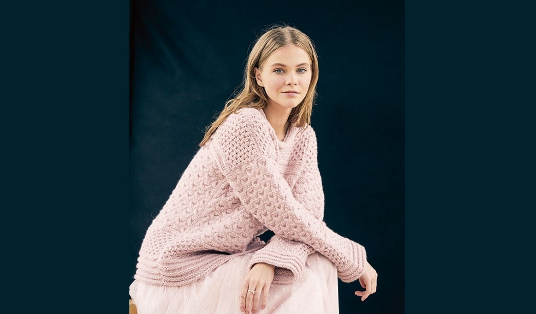 Pink pullover with a mix of patterns