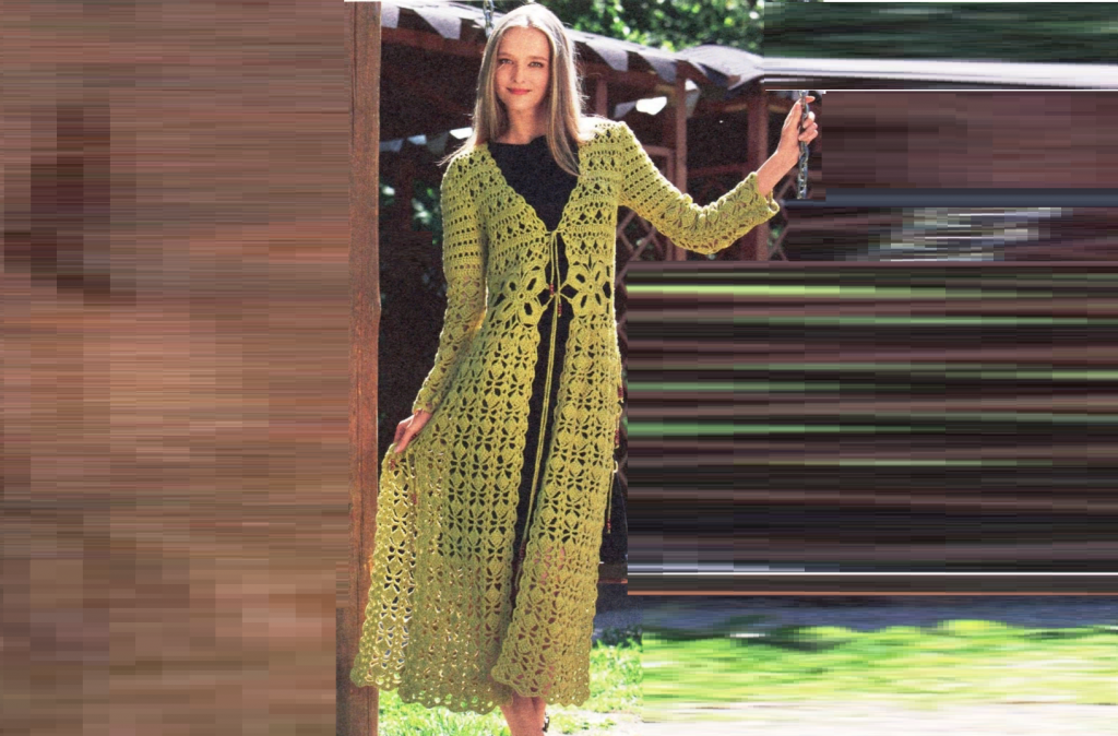 Knitted coat with an openwork pattern in light green color
