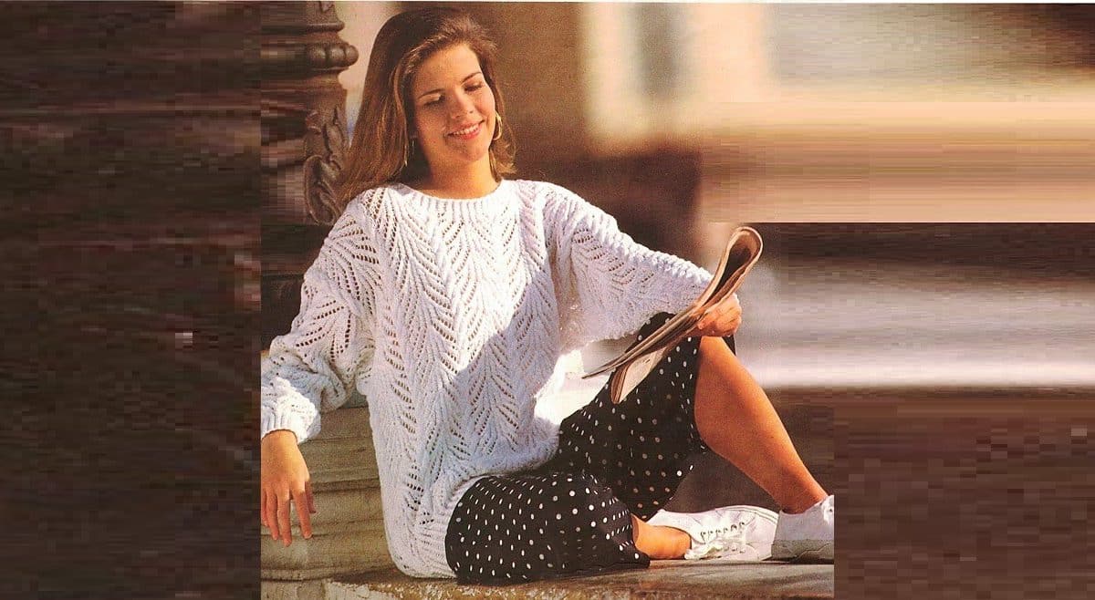 Pullover with openwork pattern and braids