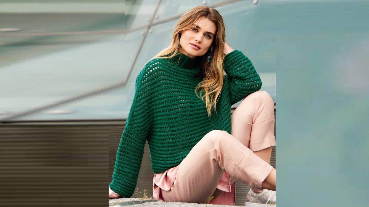 Green wool pullover with a through pattern.