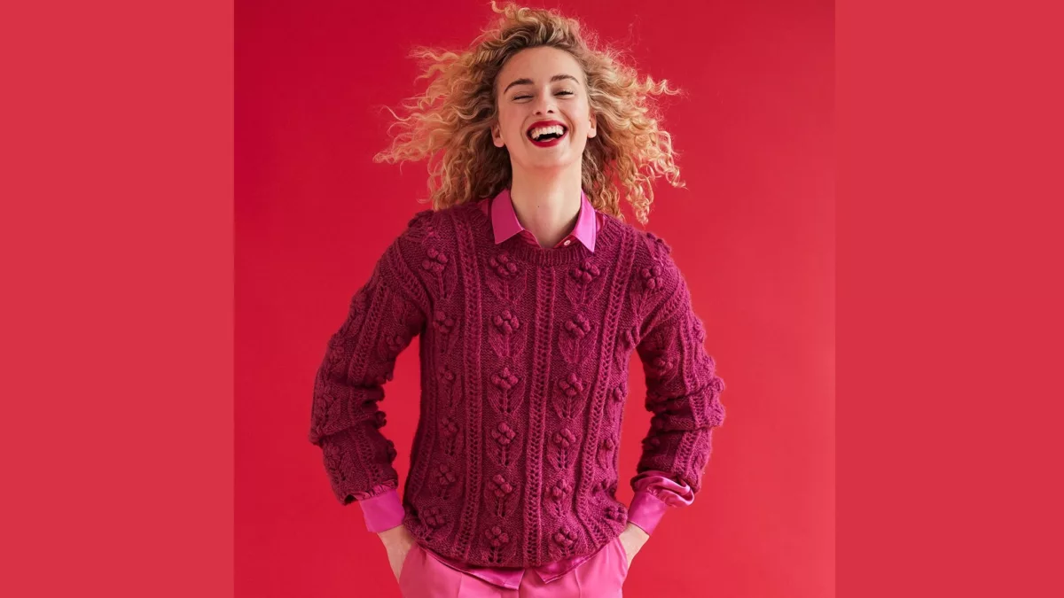 Elegant pullover with a mix of patterns and embroidery.