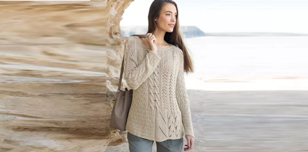 Beige pullover with a combination of patterns