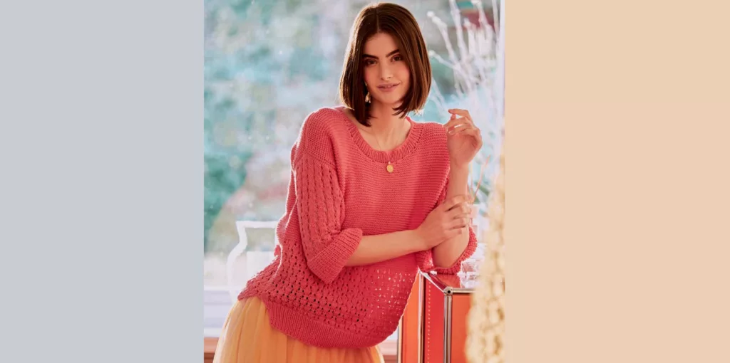 Knitted pullover with openwork patterns